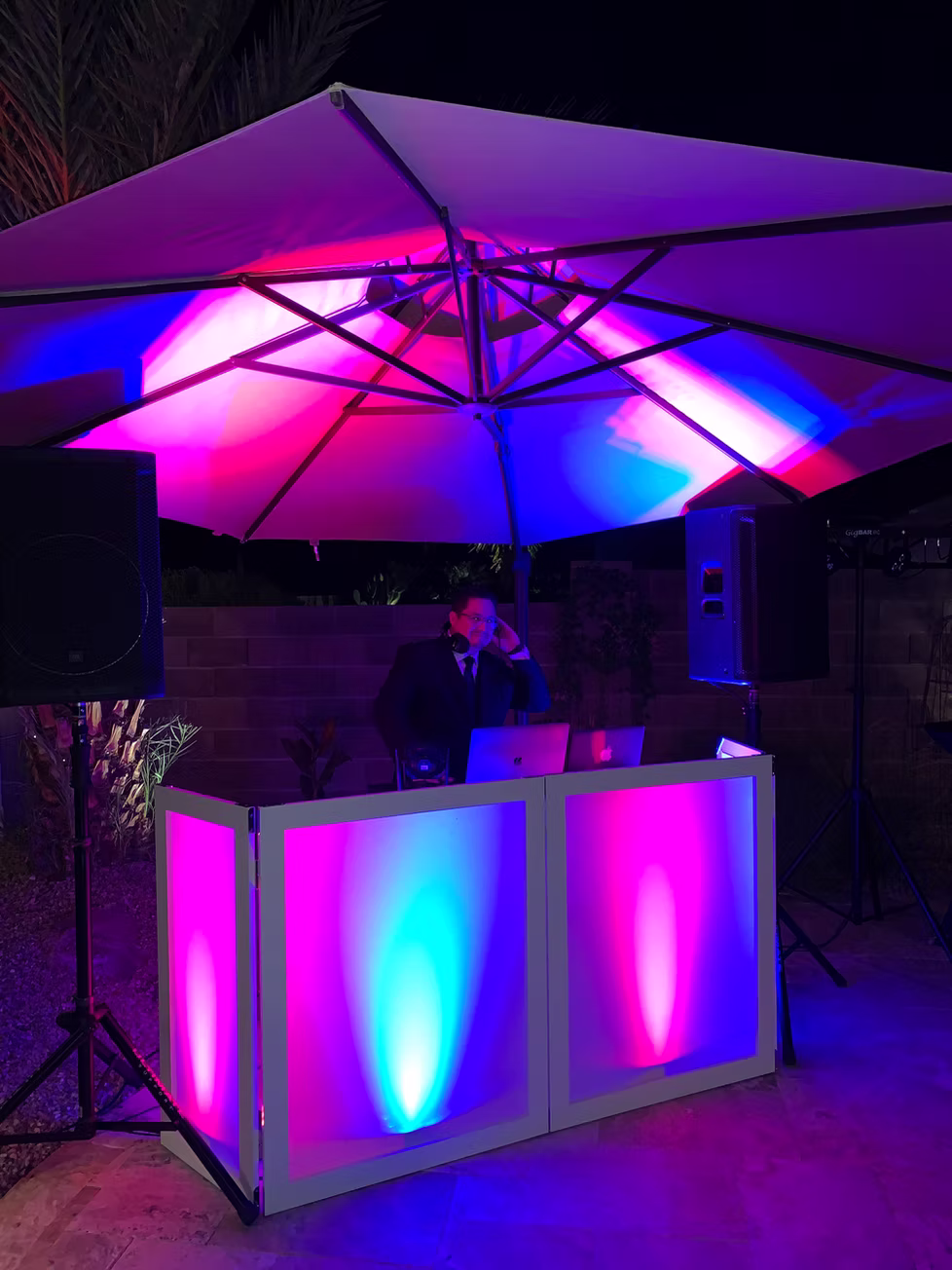 DJ Serrato performing at a Phoenix wedding reception with professional lighting