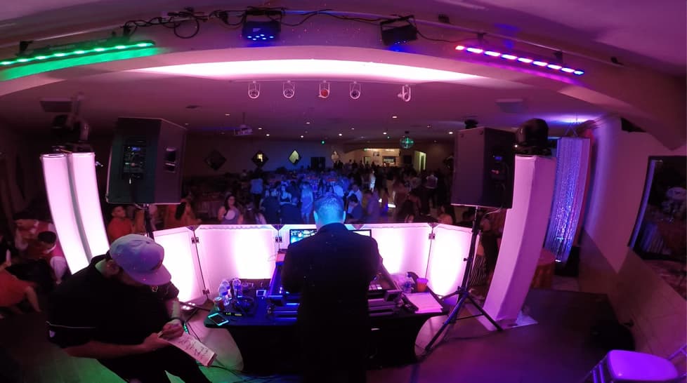 DJ Serrato at a private celebration with packed dance floor in Phoenix